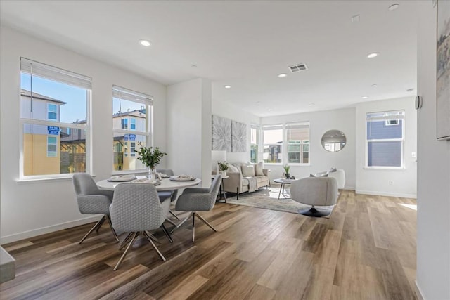 dining area with wood-type flooring