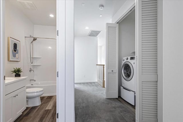 laundry area with washer / clothes dryer and dark hardwood / wood-style floors