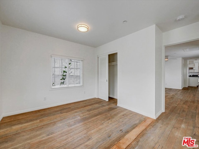 empty room with light hardwood / wood-style floors