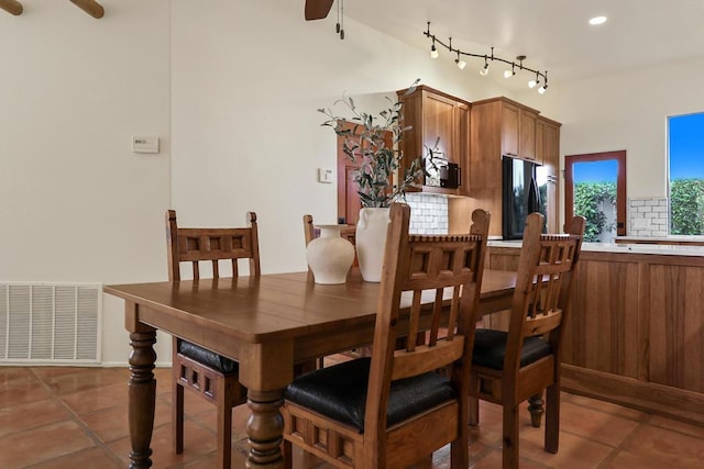 tiled dining room featuring ceiling fan