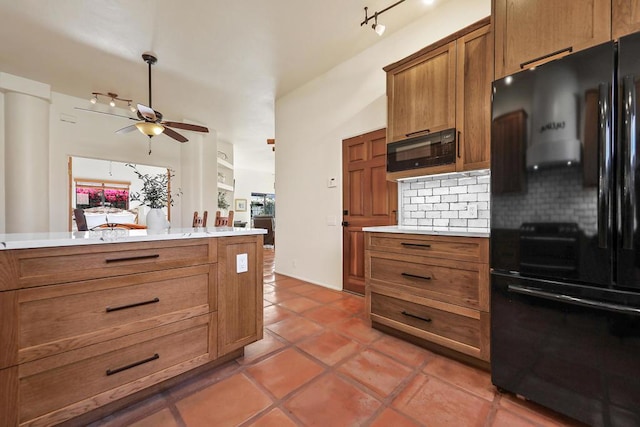 kitchen with tile patterned flooring, decorative backsplash, black appliances, and ceiling fan