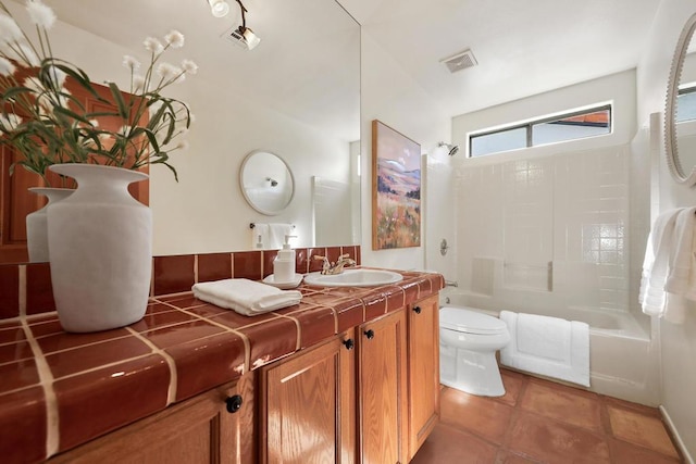 full bathroom featuring vanity, tile patterned floors, shower / bathtub combination, and toilet