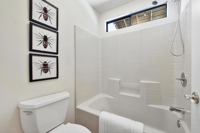 bathroom featuring washtub / shower combination and toilet