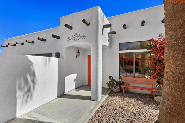 doorway to property with a patio