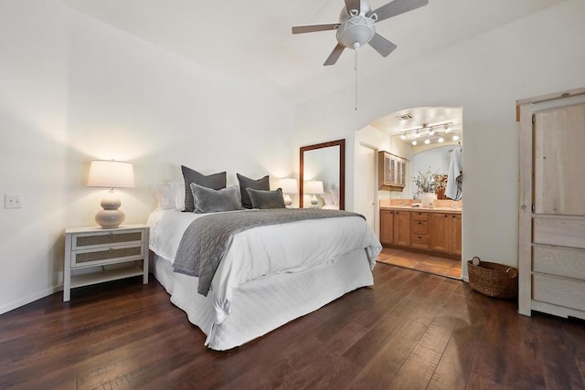 bedroom with dark hardwood / wood-style flooring, connected bathroom, and ceiling fan