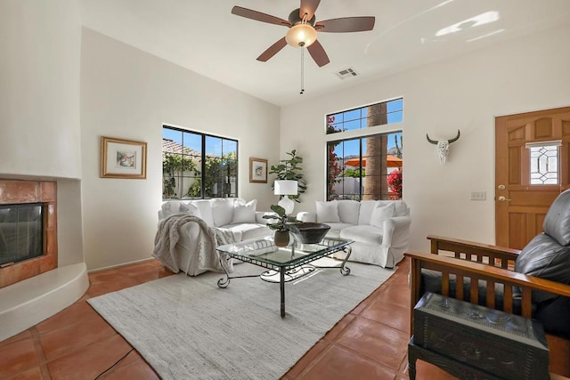 living room featuring tile patterned flooring and ceiling fan