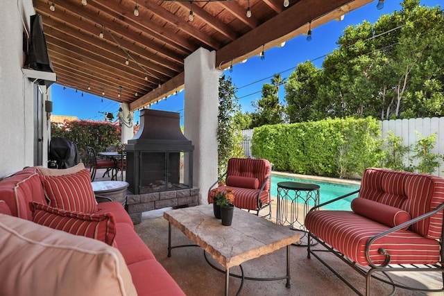 view of patio with a fenced in pool, an outdoor living space with a fireplace, and a grill