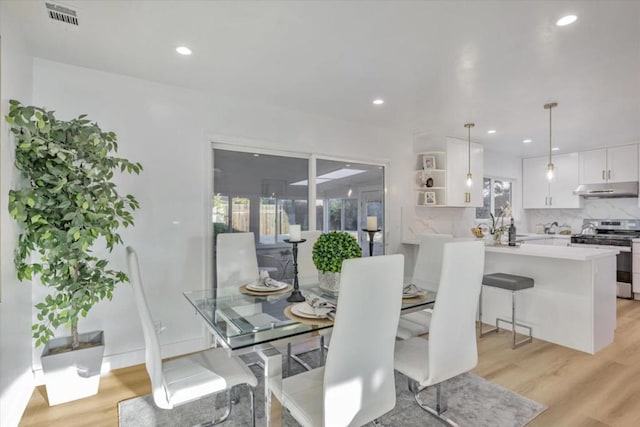 dining room with light hardwood / wood-style flooring