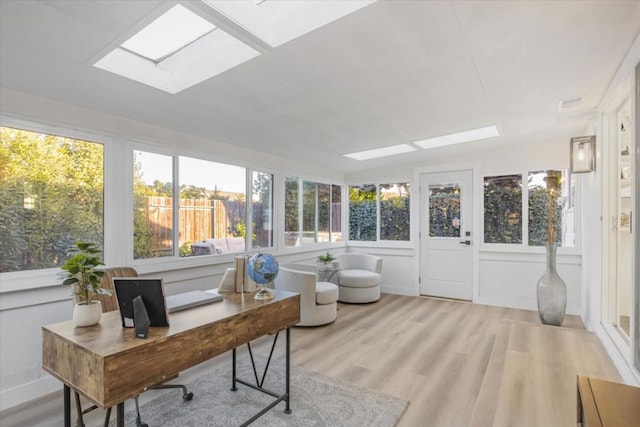 sunroom / solarium featuring a skylight