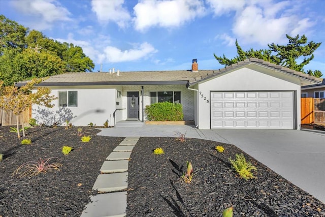 ranch-style home featuring a garage