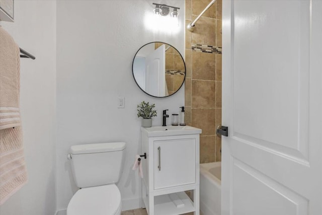 full bathroom with vanity, toilet, and tiled shower / bath combo