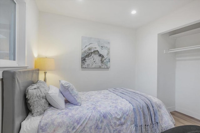 bedroom with hardwood / wood-style flooring