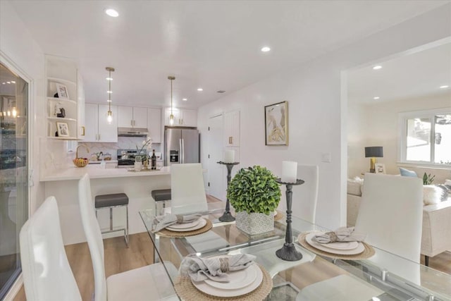 dining space featuring light hardwood / wood-style floors