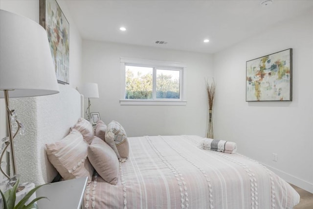 bedroom with hardwood / wood-style flooring