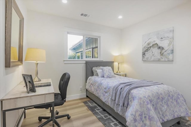 bedroom with light wood-type flooring