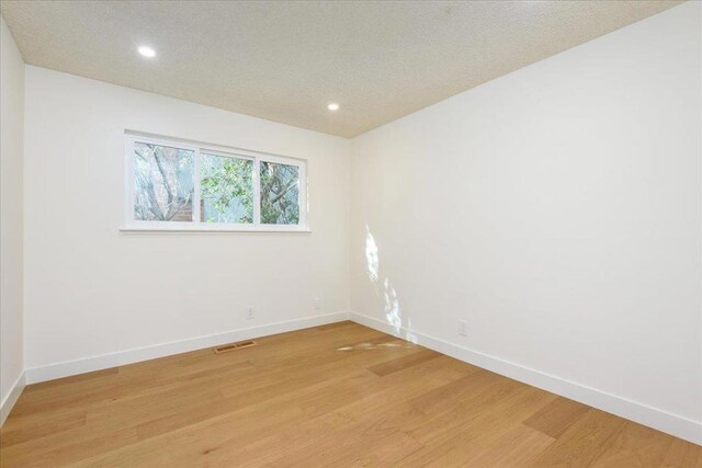 empty room featuring light hardwood / wood-style flooring