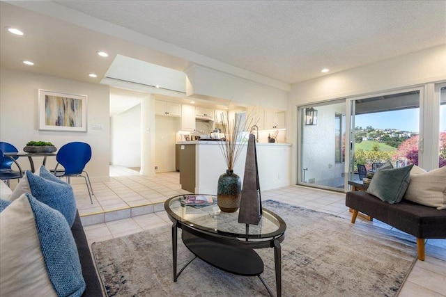 tiled living room with a textured ceiling