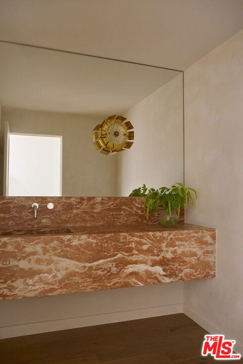 interior details featuring hardwood / wood-style flooring