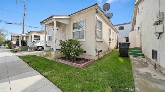 view of side of home featuring a yard