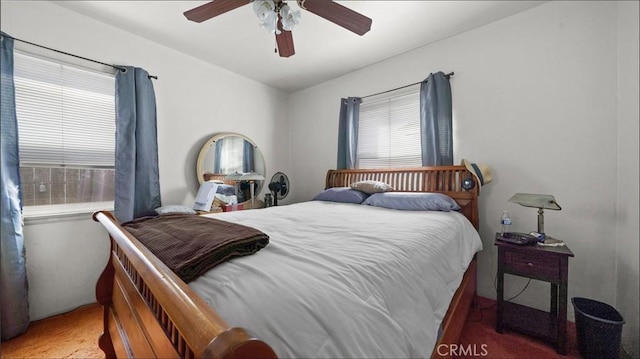 bedroom featuring vaulted ceiling, carpet, and ceiling fan