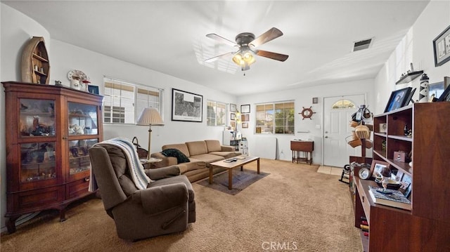 carpeted living room featuring ceiling fan