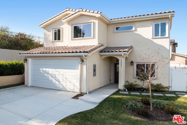 mediterranean / spanish-style house featuring a garage