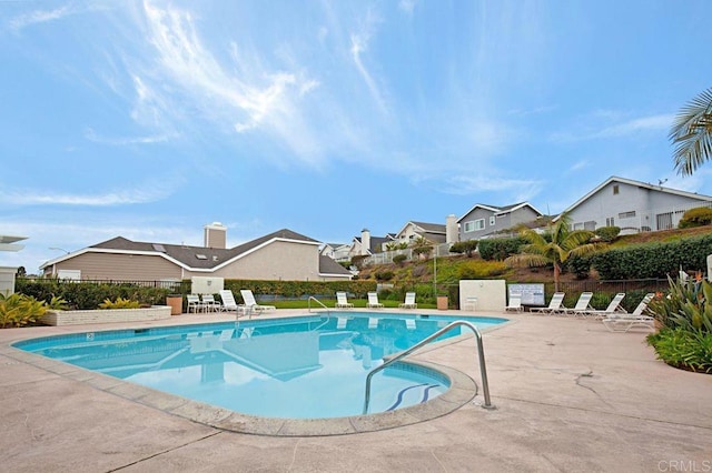 view of swimming pool with a patio area