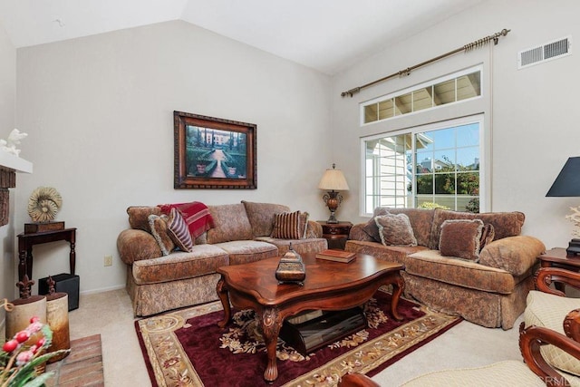 living room featuring carpet flooring and vaulted ceiling