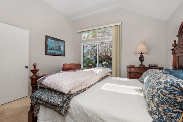 carpeted bedroom with vaulted ceiling