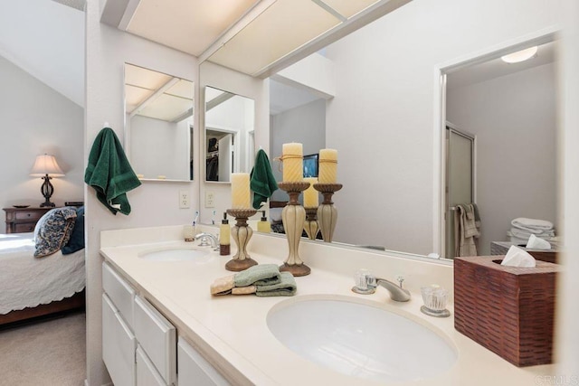 bathroom featuring vanity and a shower with shower door