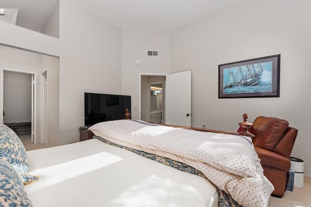 bedroom featuring high vaulted ceiling and carpet floors