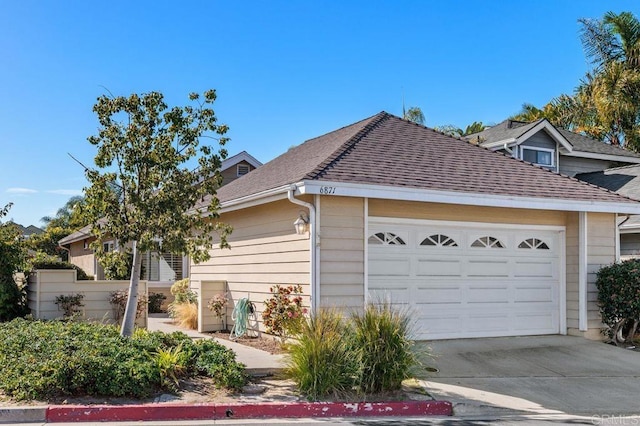 view of side of home with a garage