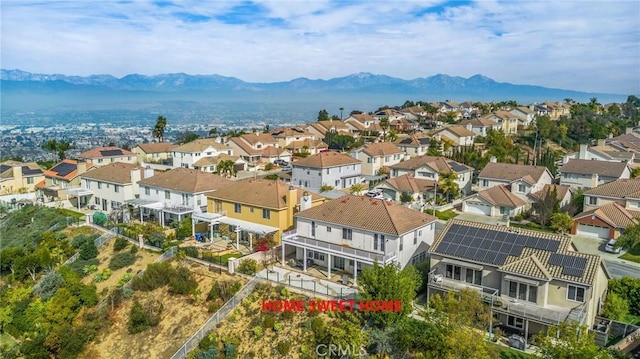 birds eye view of property featuring a mountain view