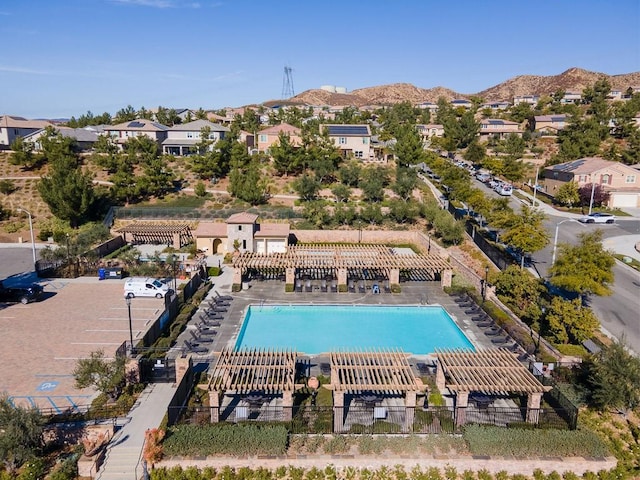 view of swimming pool with a mountain view