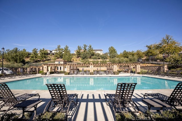 view of swimming pool with a patio area