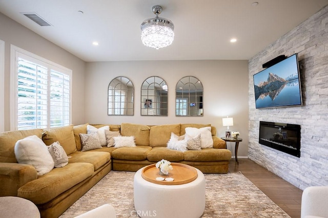 living room featuring hardwood / wood-style flooring and a fireplace