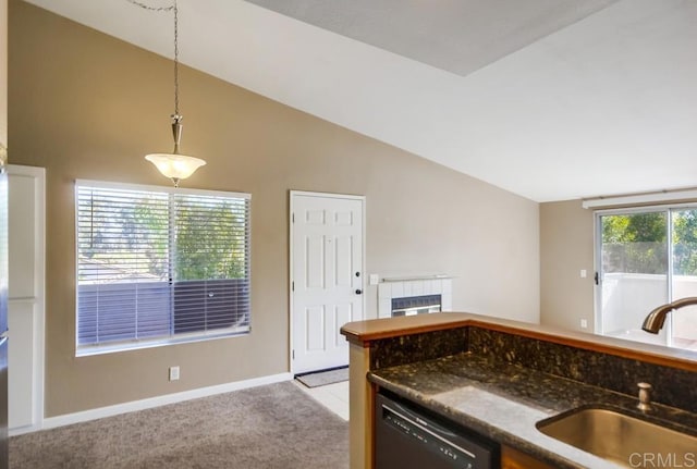 kitchen featuring vaulted ceiling, pendant lighting, dishwasher, sink, and light colored carpet