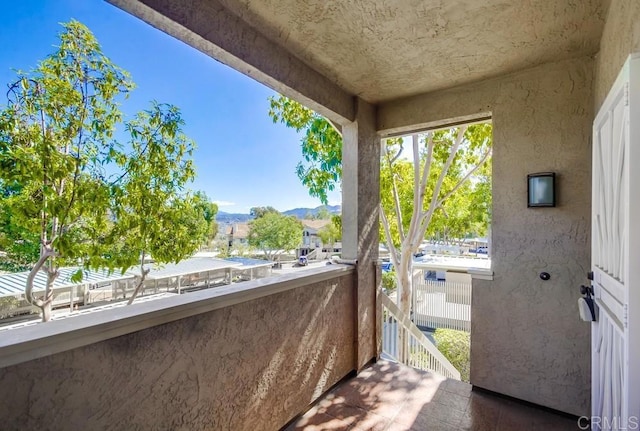 balcony featuring a mountain view