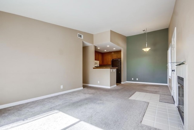 unfurnished living room with light carpet