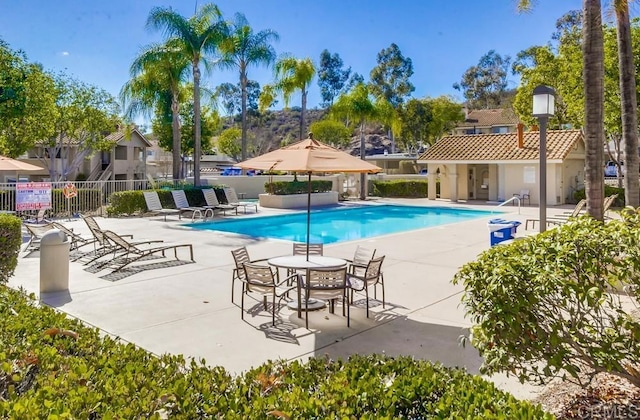 view of swimming pool with a patio area