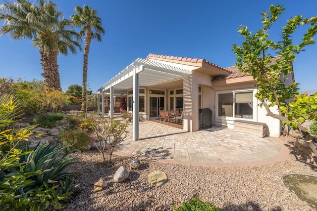 back of house featuring a pergola and a patio