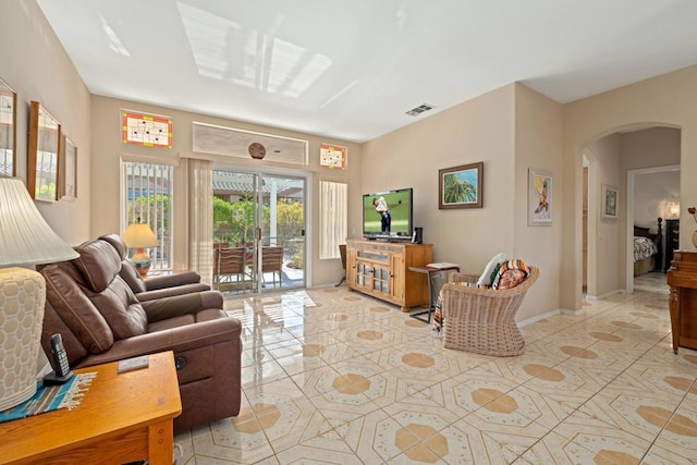 living room featuring light tile patterned flooring