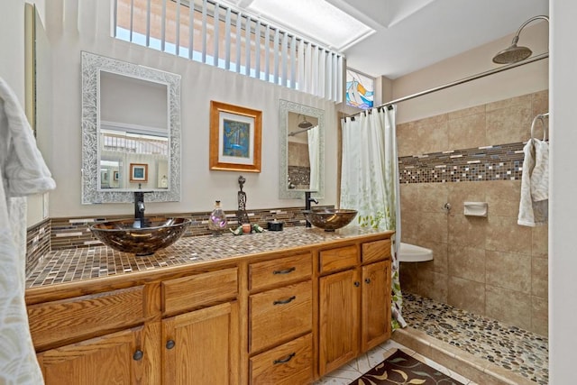 bathroom with vanity, tile patterned floors, and a shower with curtain