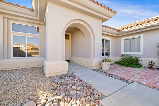 entrance to property with a patio area