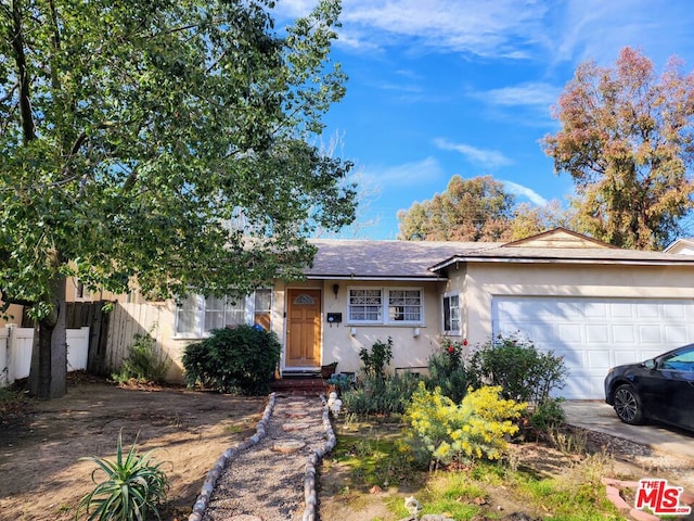 single story home with a garage