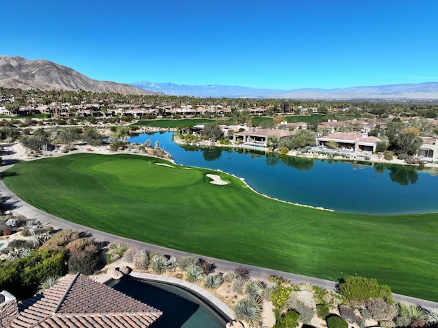 drone / aerial view with a water and mountain view