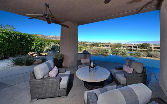 view of patio featuring an outdoor living space and ceiling fan