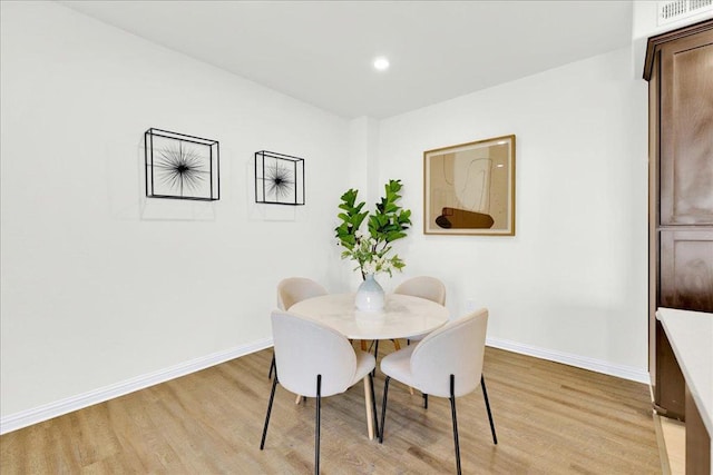 dining room with light hardwood / wood-style floors