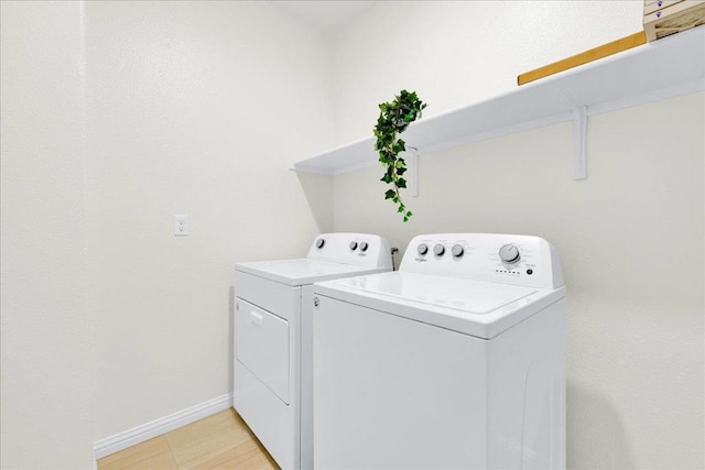 washroom featuring separate washer and dryer