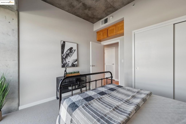 carpeted bedroom featuring a closet